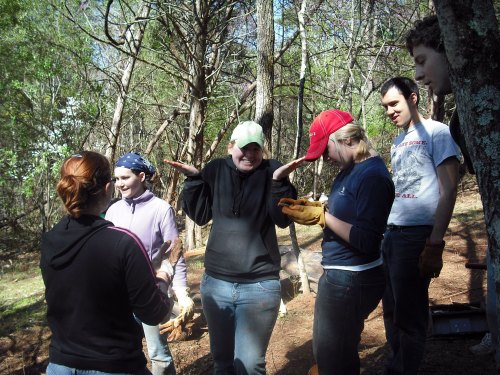 W&L students with Makenzie Hatfield '12 at center and Aleisha Butler at right examining an artifact